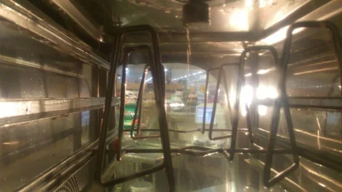 Industrial kitchen dishwasher in cleaning cycle, spraying routine water Stock Footage 101456083