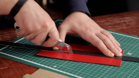 Industrial knife man cuts the work piece from the skin Stock Footage 88874123