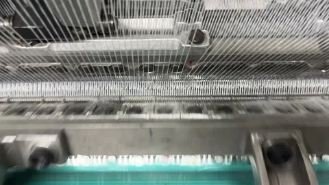 Industrial knitting machine for knitting textile fabrics Stock Footage 239680839