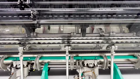 Industrial knitting machine for knitting textile fabrics Stock Footage 240120313