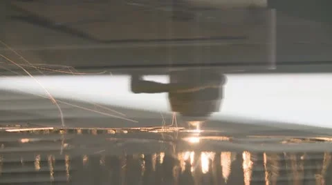 An industrial laser cuts a pattern in metal Stock Footage 10861722
