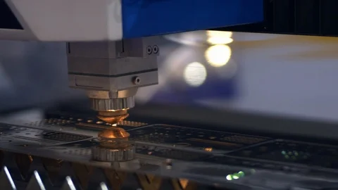 Industrial laser cutter with sparks. The programmed robot head cuts with the aid Video stock 108009954