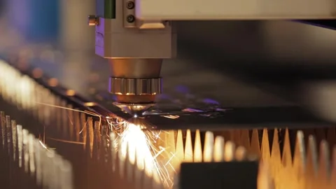 Industrial laser cutting machine in motion creates precise patterns on meta.. Stock Footage 337351716