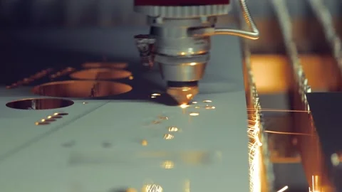 Industrial laser cutting machine processing metal sheet with sparks and glo.. Stock Footage 337356005