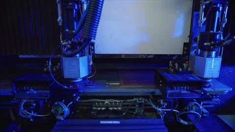 Industrial laser cutting machine processing material in factory Stock Photos