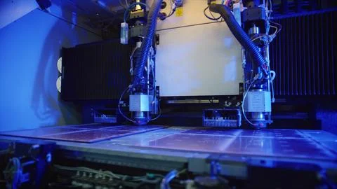 Industrial laser cutting machine processing metal sheets in factory Stock Photos