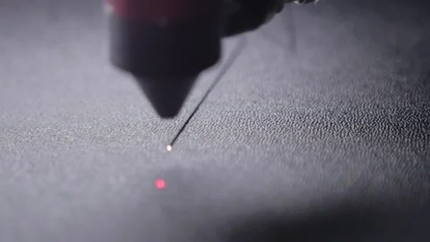 Industrial laser is cutting a pattern on a plastic Stockbeeldmateriaal 153415887