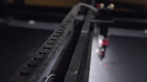 Industrial laser is cutting a pattern on a plastic Stockbeeldmateriaal 153415995