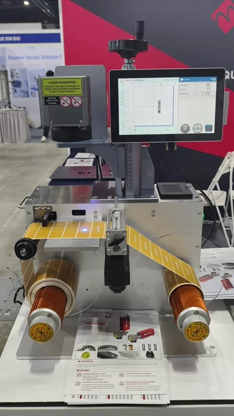 An industrial laser marking and label rewinding machine Stock-Footage 336839231