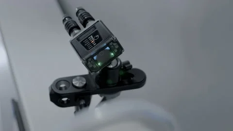 An industrial laser sensor on a conveyor detects the passage of a  containers 스톡 동영상 167390858