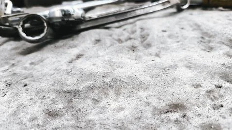 Industrial layout of hardware tools on cement flooring surface with room fo.. Stock Photos
