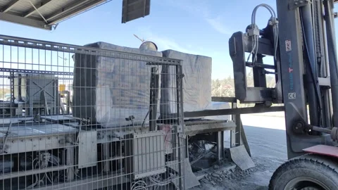 Industrial Logistics: Forklift Loading Cement Pallets in Factory Stock Footage 333450012