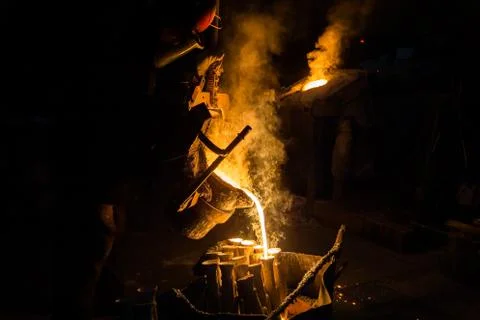 Industrial lost wax casting. The process of pouring for filling out ceramic Stock Photos