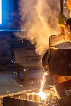 Industrial lost wax casting. The process of pouring for filling out ceramic Stock Photos