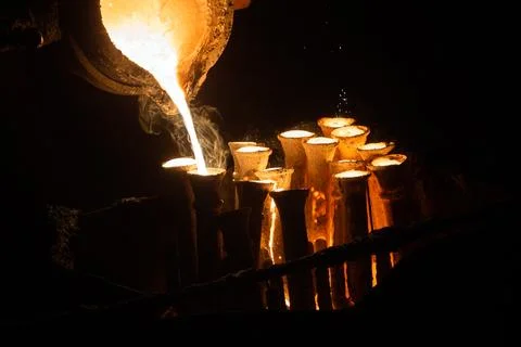 Industrial lost wax casting. The process of pouring for filling out ceramic.. Stock Photos