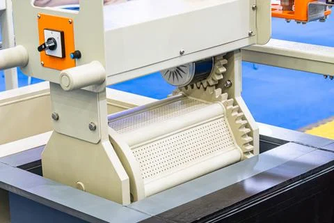 Industrial machine close-up, technical concept, white cylindrical component.. Stock Photos