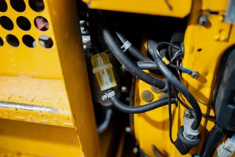 Industrial machine engine compartment with cables, hoses Stock Photos