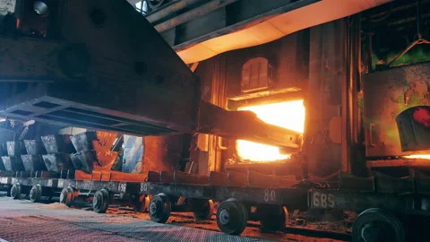Industrial machine is loading copper materials into a furnace Stock Footage 158164413