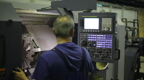 Industrial Machine Operator. Console for controlling an industrial machine. Male Stock Footage 54983141