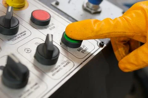 Industrial Machine Operator Controlling the Control Panel for Metal Cutting Fotos de archivo
