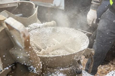 Industrial Machine Processing Material with Visible Dust and Debris 스톡 사진
