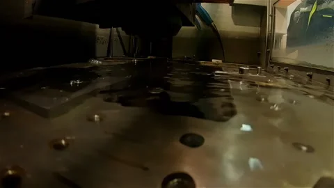 An industrial machine uses a bright laser underwater for material welding Stock Footage 197344666