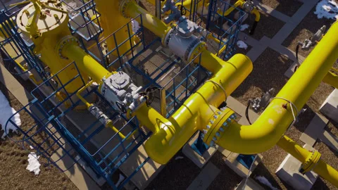 Industrial machinery complex web yellow pipes carries assortment fluids Stock Footage 274849447
