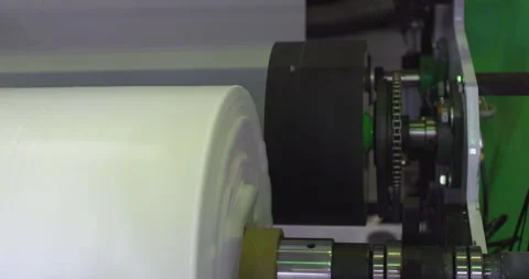 Industrial machinery processing white plastic roll in factory Stock Footage 302264638