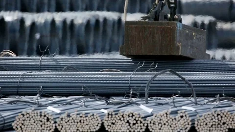 Industrial magnet loading steel bars by the railway close up Stock Footage 72424324