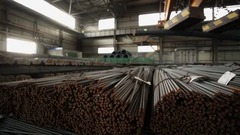 Industrial magnet loading steel bars inside the warehouse wide shot Stock Footage 72424372