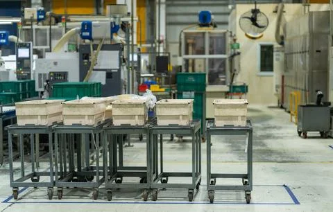 Industrial Material Handling Carts with Work Containers in a Manufacturing .. Stock Photos