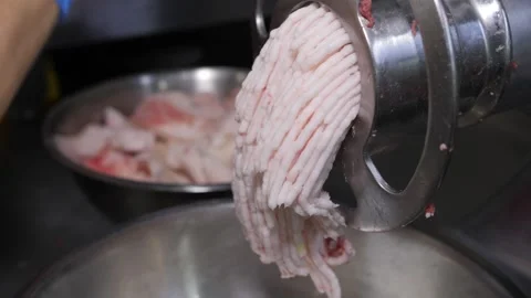 Industrial meat grinder processing fresh raw pork fat Stock Footage 331248221