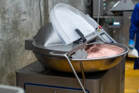 Industrial Meat Processing Machine with Fresh Ground Meat 2 Stock Photos