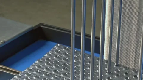 Industrial Metal Bars Gliding Through Precision Machinery in a Quiet Factory Stock Footage 340486412