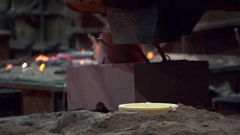 The Industrial Metal Casting Process in a Traditional Workshop Setting and Stock Footage 282967321