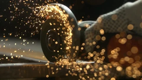 Industrial metal cutting process with angle grinder creating bright orange .. Stock Footage 337613461