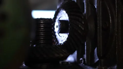 Industrial metal rolling machine shaping threaded rod in metallurgy workshop. Stock Footage 313815368