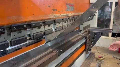 Industrial metal sheet bending process on press brake machine Stock Footage 345065624