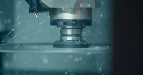 Industrial milling machine spindle processing metal workpiece with particles Stockbeeldmateriaal 329681913