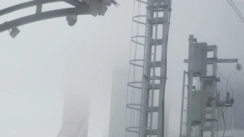Industrial misty view from train window. Fog all over the city with skyscapes. Видео 148788027