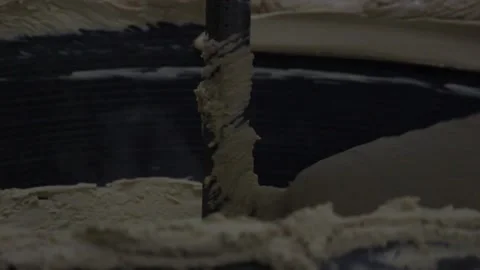 An industrial mixer makes a mixture for making sweet bars Stock Footage 128642944