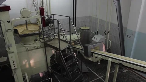 An industrial mixer prepares a mixture for making sweet bars Stock Footage 128642935