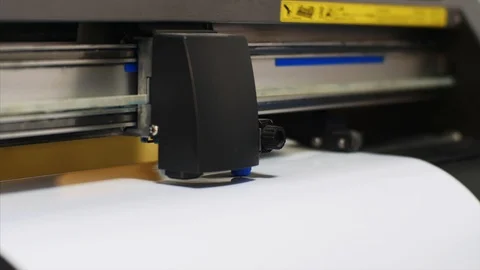 Industrial modern plotter machine cutting self-adhesive film in typography. 動画素材 114739189