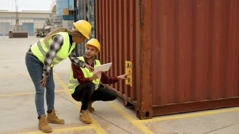 Industrial multiracial operators working at container freight cargo logistics Stock Footage 182583088