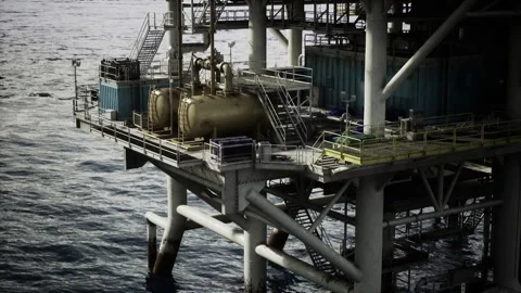 Industrial offshore setup illuminated by soft ambient lighting at night Stock Footage 338343387