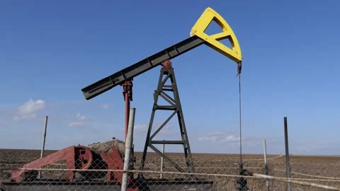 Industrial oil pump jack pumping crude oil. Stock Footage 132657545