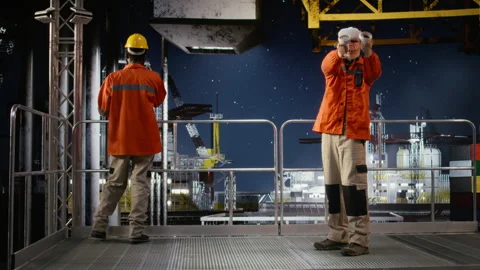 Industrial oil rig worker uses VR glasses to practice safety protocols Stock Footage 324705357