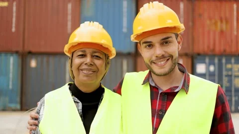 Industrial operators working at container cargo logistics terminal - Authentic Stock Footage 182584234