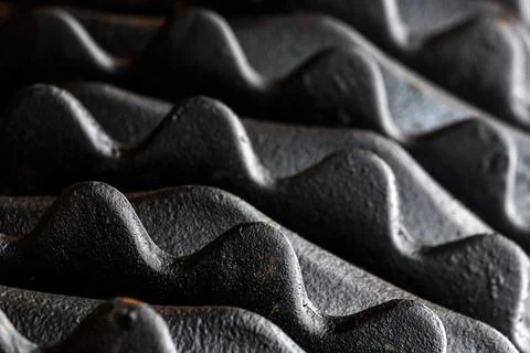 Industrial pattern, closeup of black metallic harrow disks with teeth for s.. Stock Photos