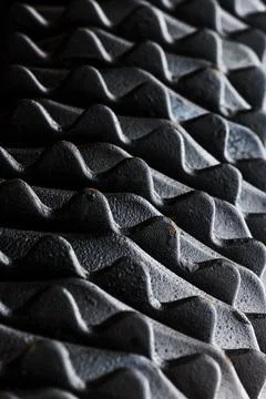 Industrial pattern, closeup of black metallic harrow disks with teeth for s.. Stock Photos